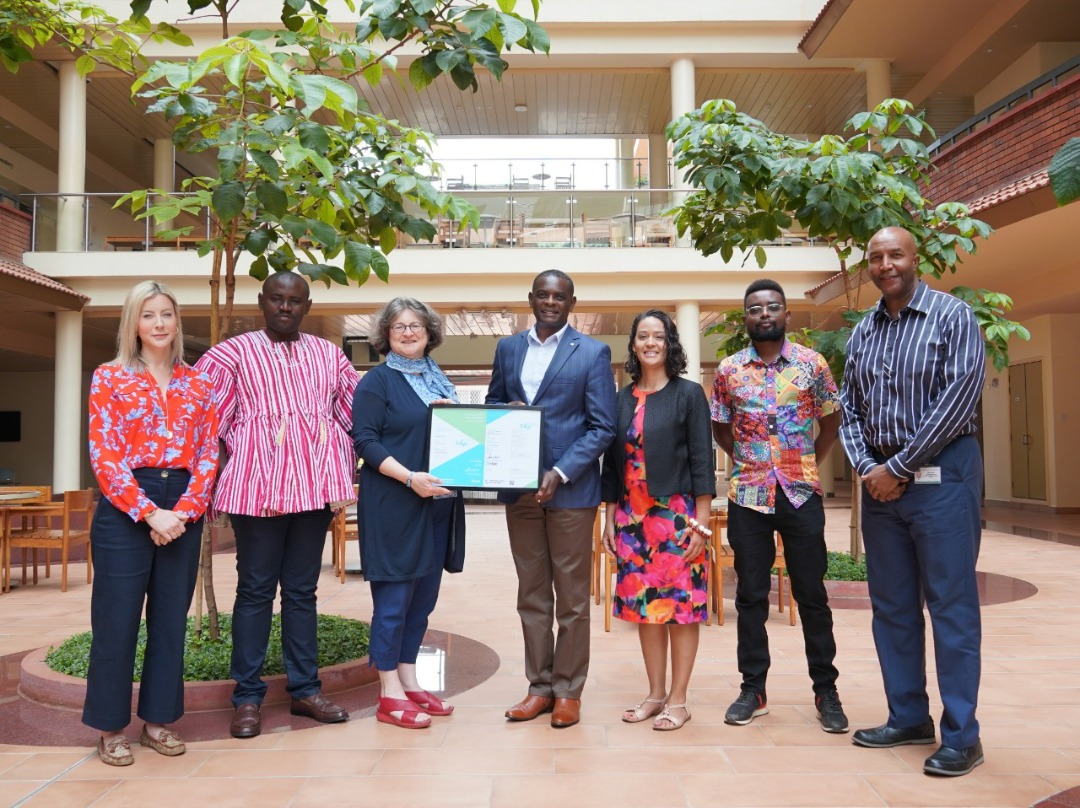 AKU Vice Provost Prof. Alex Awiti receives the EDGE certification from Kenya Green Building Society